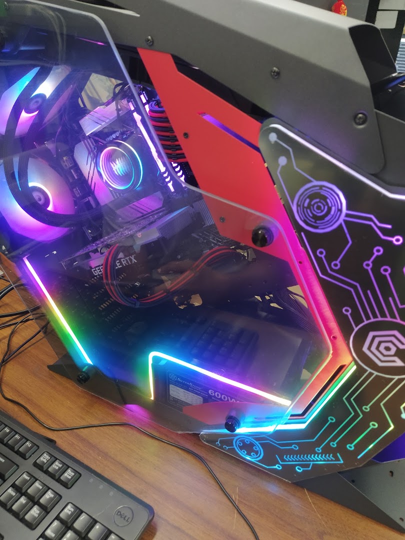 A vibrant gaming PC setup showcasing internal components with colorful RGB lighting and a sleek case design.