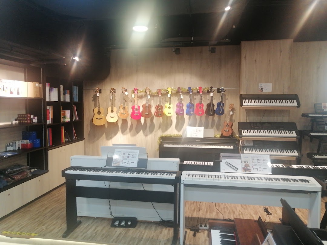An interior view of Cristofori Music, showcasing a variety of keyboards, pianos, and colorful ukuleles.