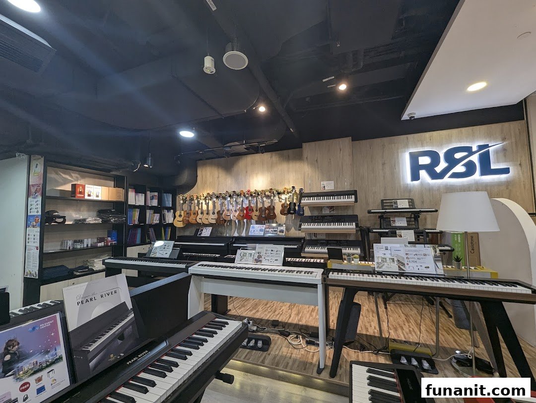 Interior view of Cristofori Music, showcasing a wide array of pianos, keyboards, and ukuleles.