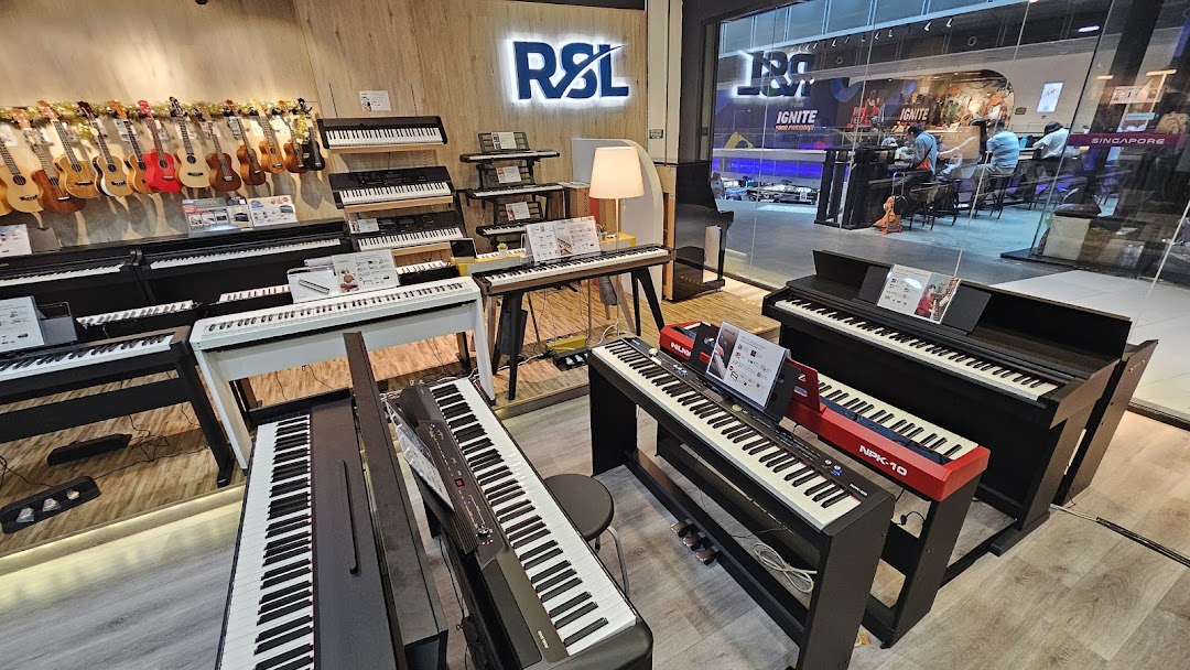 An interior view of Cristofori Music, showcasing a wide array of pianos, keyboards, and ukuleles.