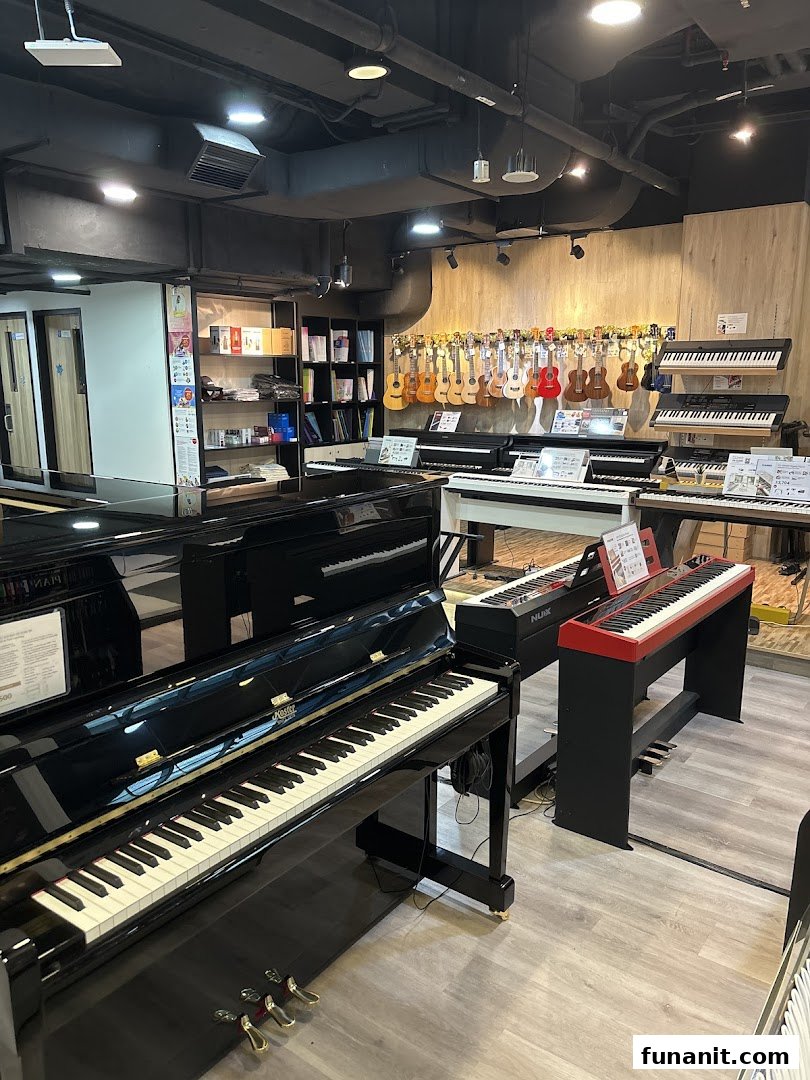 Interior view of Cristofori Music Experiential Center, showcasing pianos, keyboards, and ukuleles.