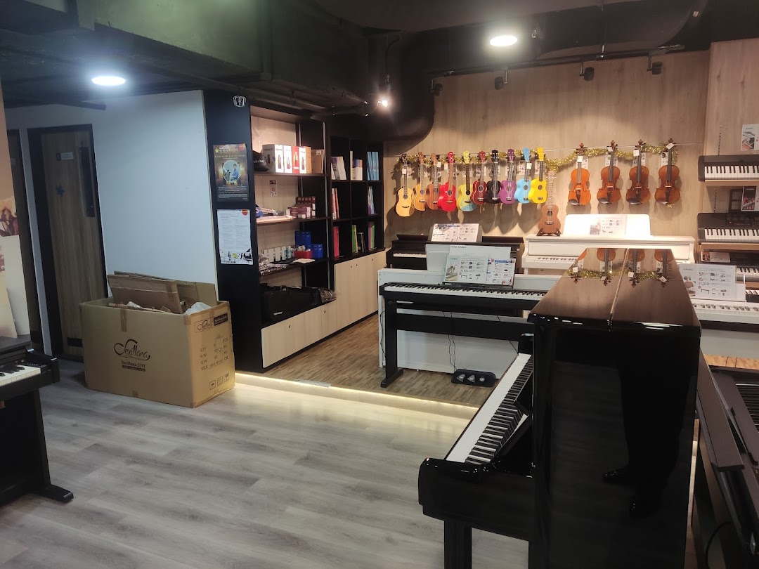 Interior view of Cristofori Music shop displaying pianos, ukuleles, and violins.