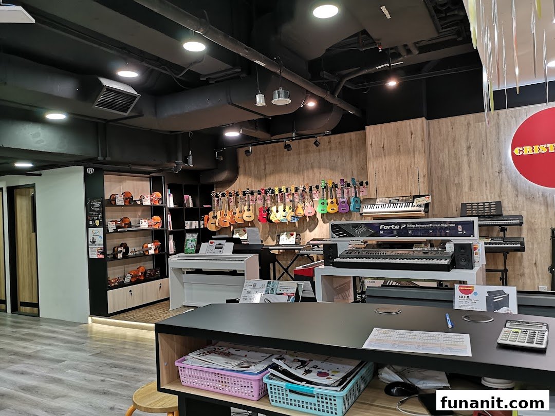 Interior view of Cristofori Music, showcasing various musical instruments like ukuleles, keyboards, and violins.