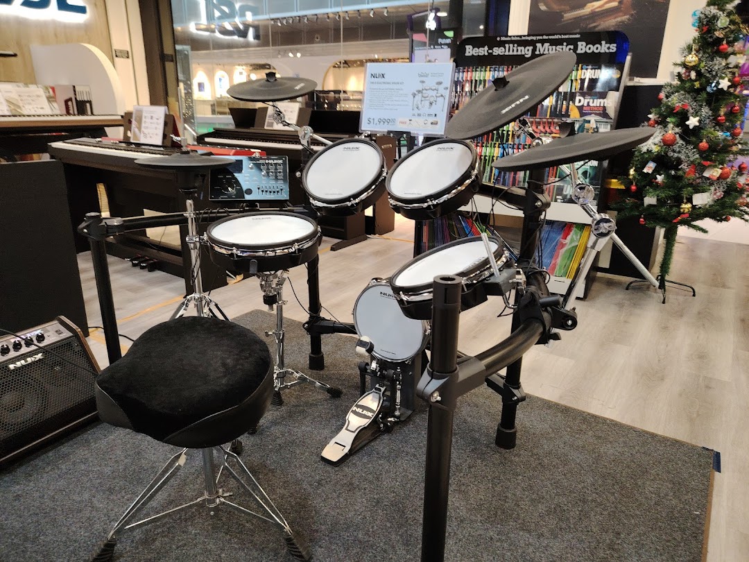 An electronic drum kit and keyboards displayed in Cristofori Music Experiential Center.