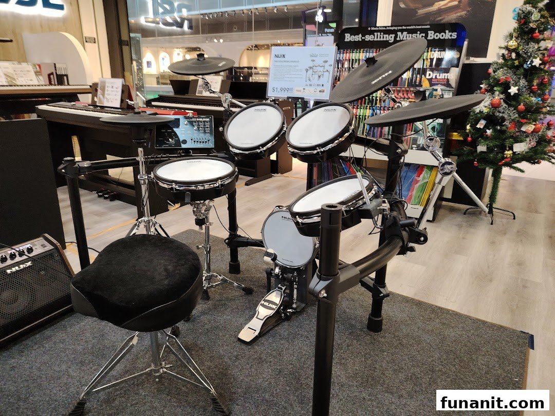 An electronic drum kit and keyboards displayed in Cristofori Music Experiential Center.