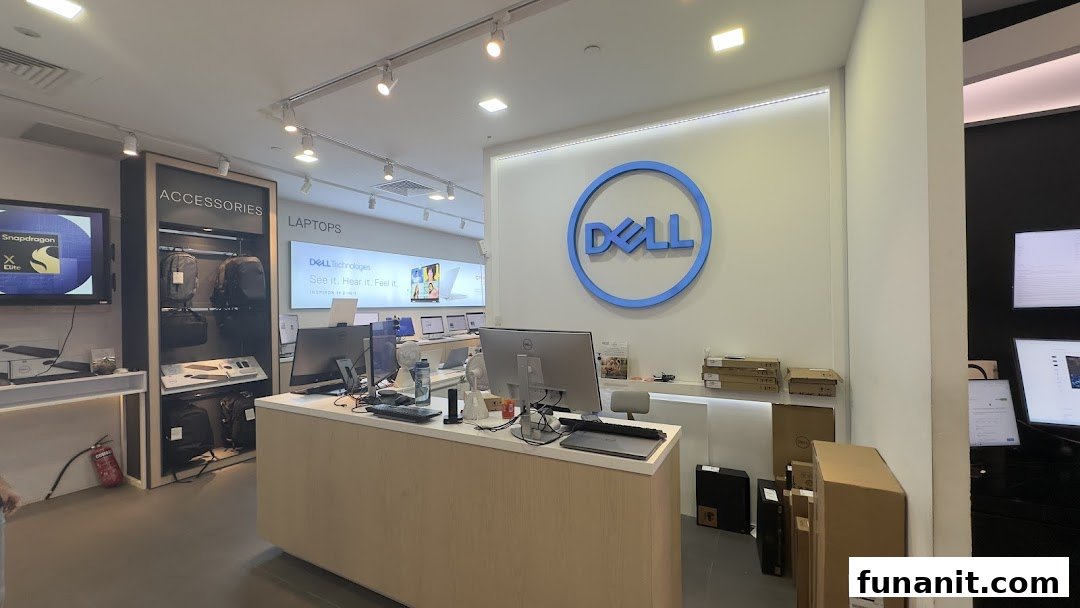 Interior view of a Dell Exclusive Store, showcasing laptops, accessories, and the prominent Dell logo.