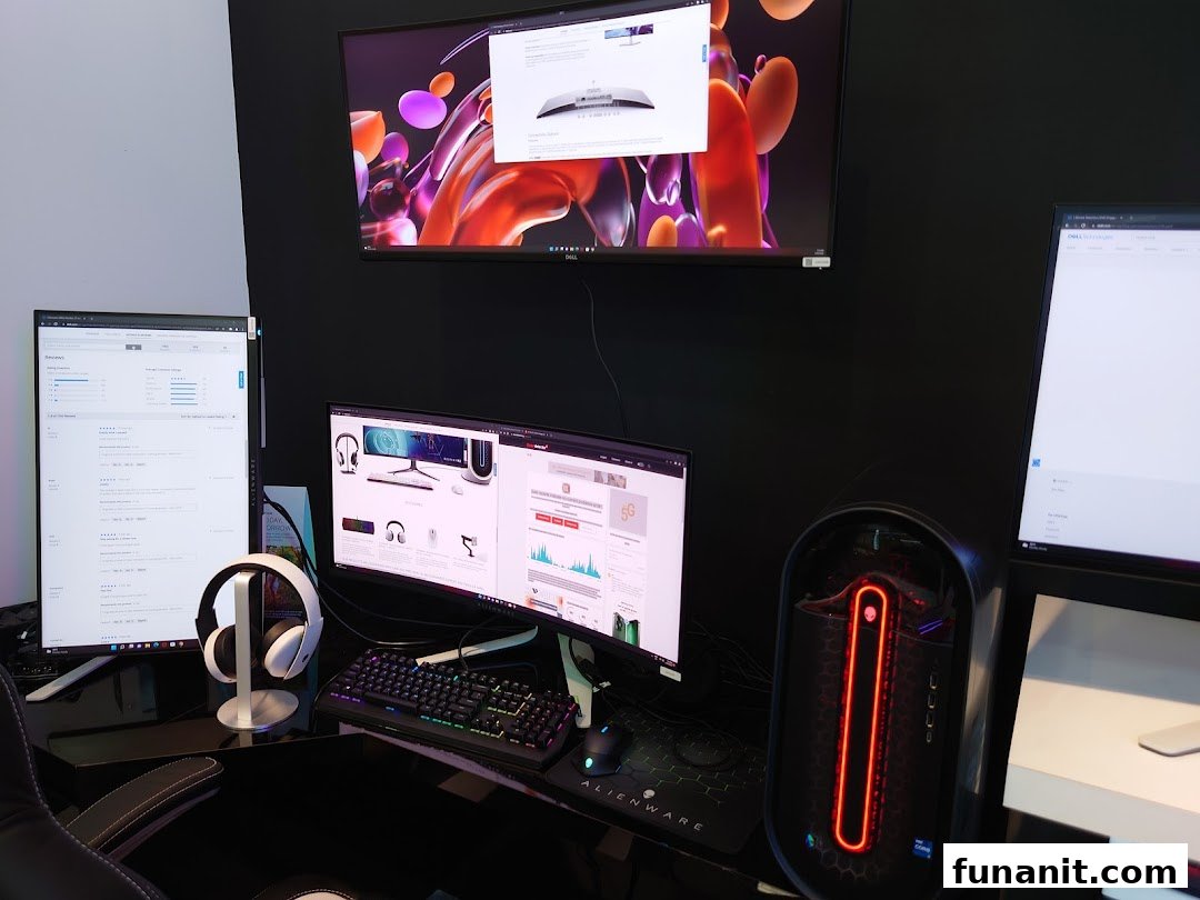 A high-performance Dell and Alienware gaming setup featuring multiple monitors, a PC, and headphones.