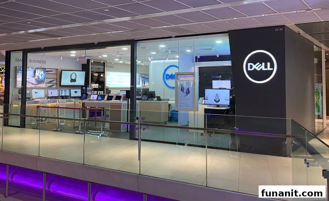 The image shows the brightly lit exterior of a Dell Exclusive Store, showcasing laptops and accessories.