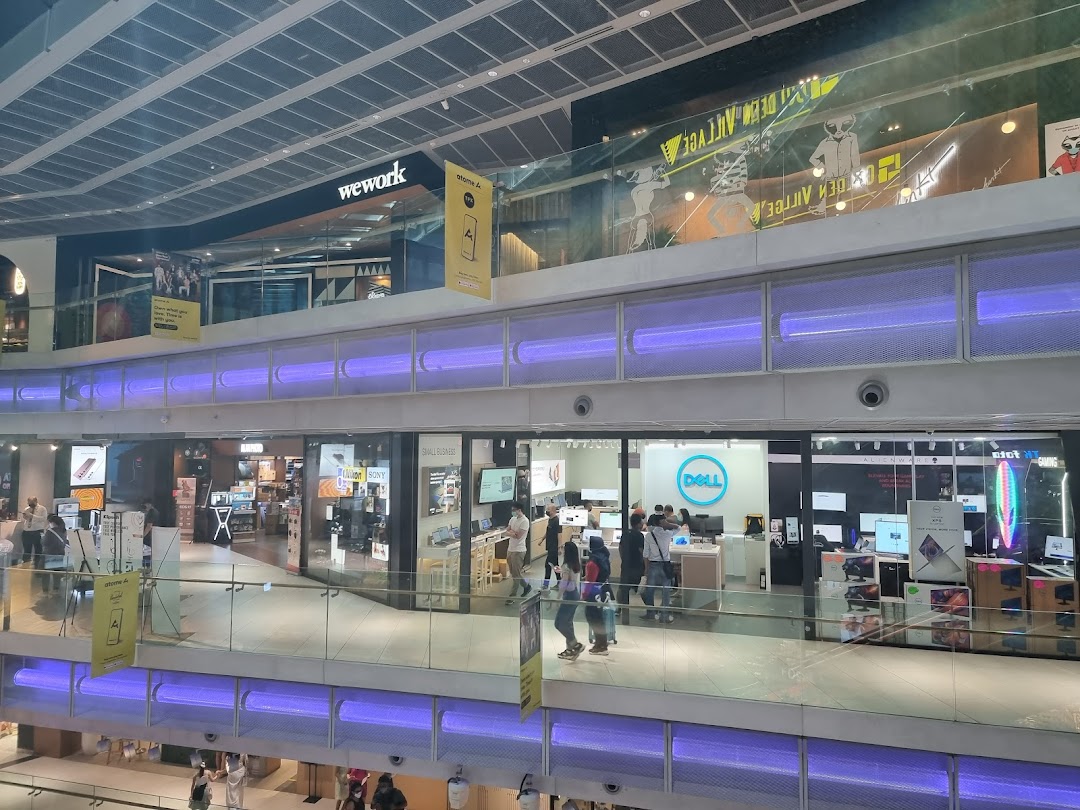 View of Dell Exclusive Store Funan from across a mall walkway, showcasing its entrance and products.