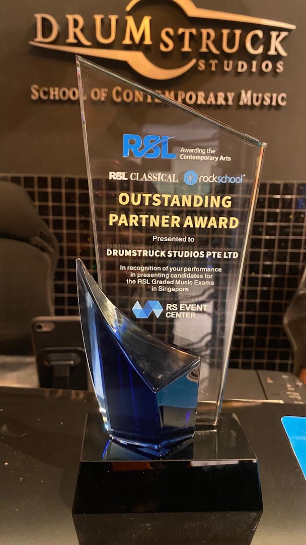 An 'Outstanding Partner Award' presented to Drumstruck Studios for excellence in music education.