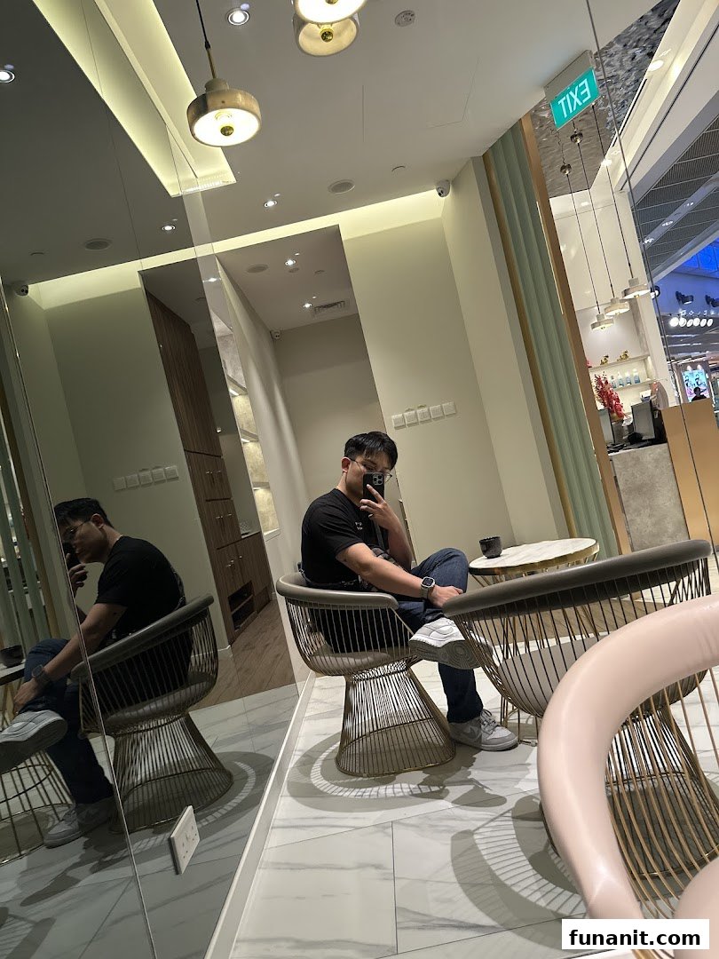 Interior shot of a modern salon or clinic waiting area with a person seated.