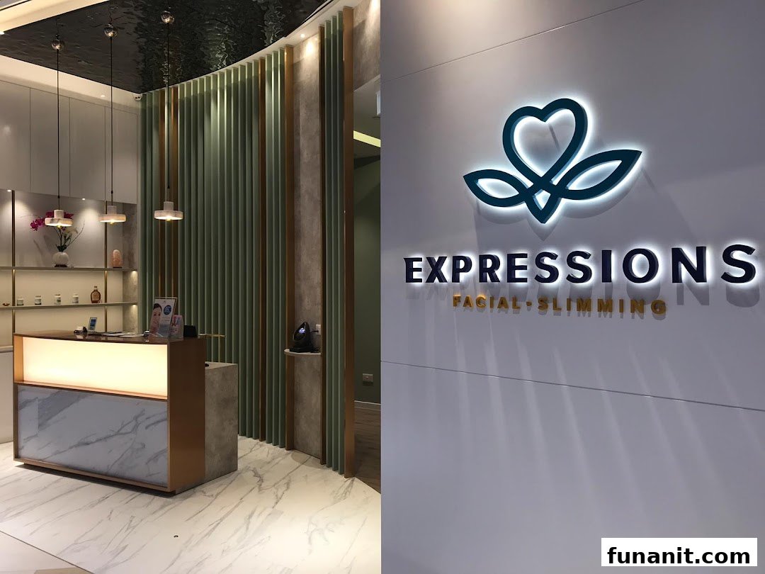 Modern reception area and illuminated logo of Expressions Facial + Slimming.