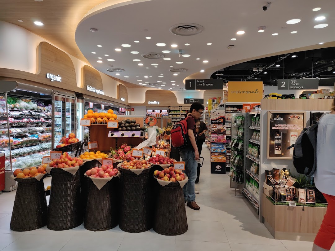 Interior view of FairPrice Finest supermarket, showcasing fresh produce, organic sections, and various groceries.
