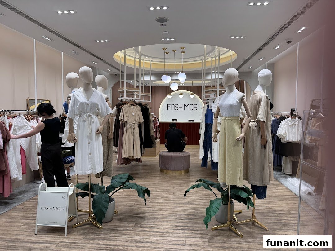 Interior view of Fash Mob boutique showcasing stylish women's apparel on mannequins and racks.