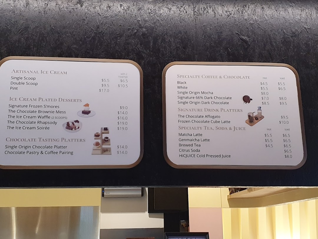 Two menu boards displaying artisanal ice cream, chocolate desserts, specialty coffee, and teas.