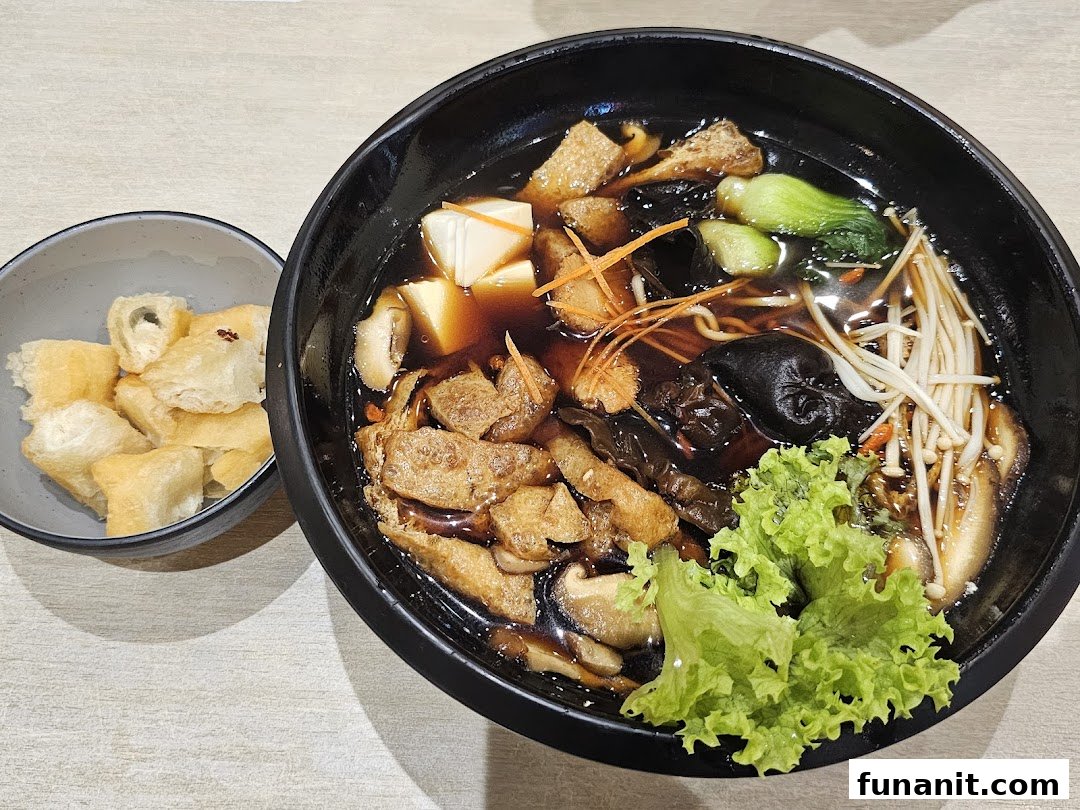 A rich, dark broth soup with assorted mushrooms, tofu, vegetables, and a side of crispy fried dough.