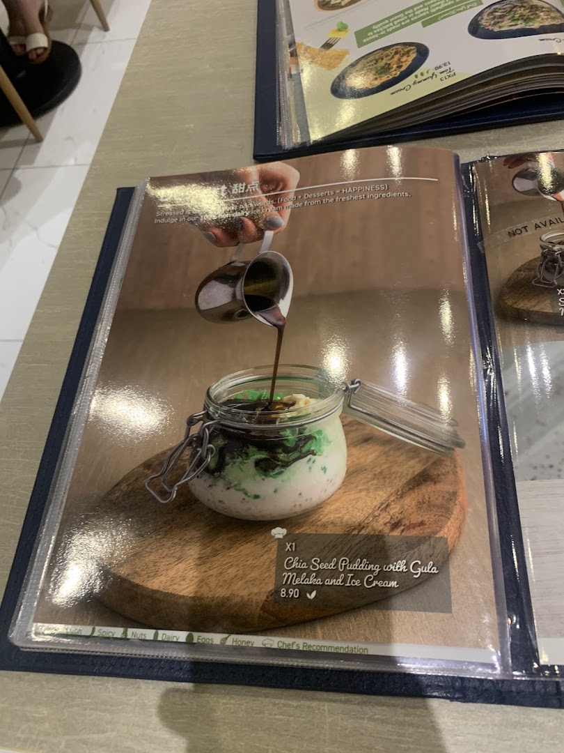 A menu page showcasing a delicious Chia Seed Pudding with Gula Melaka and Ice Cream dessert.