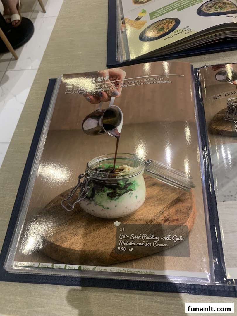 A menu page showcasing a delicious Chia Seed Pudding with Gula Melaka and Ice Cream dessert.