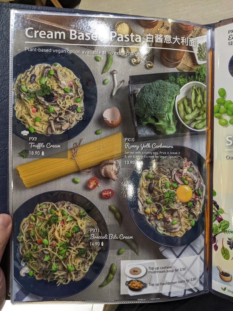A menu page from Flavours by Saute showcasing various cream-based pasta dishes with vegan options.