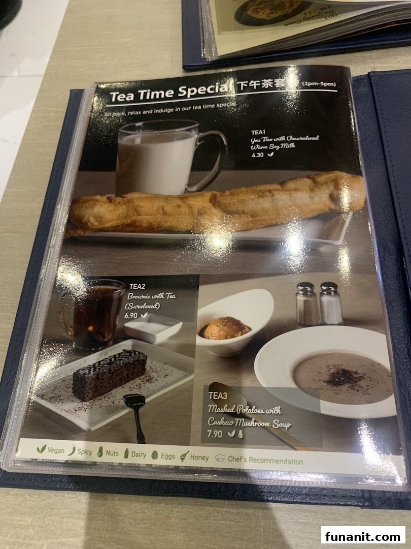 A menu page displaying the 'Tea Time Special' offerings with prices and dietary icons.