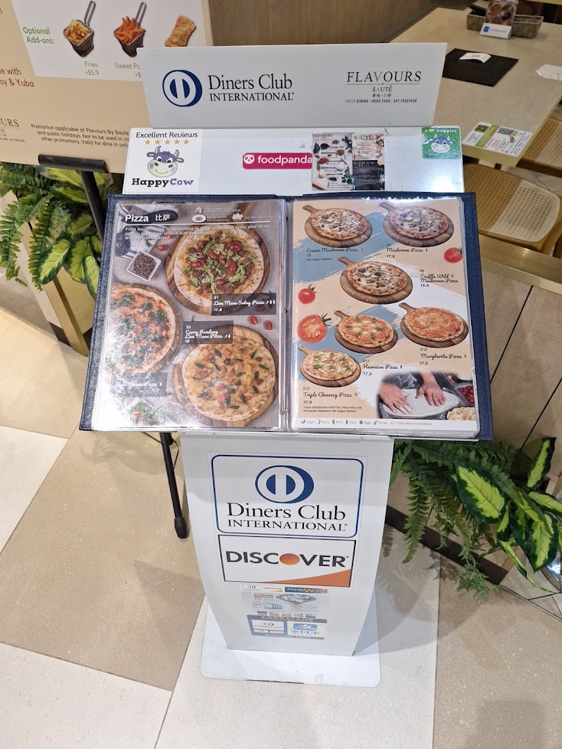 A menu stand displaying various vegetarian and vegan pizza options from Flavours by Saute.