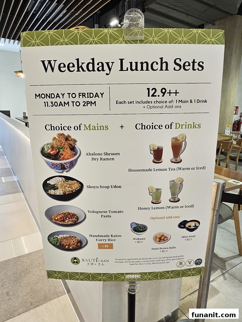 A large sign displaying the Weekday Lunch Sets menu for Flavours by Saute, featuring mains, drinks, and add-ons.