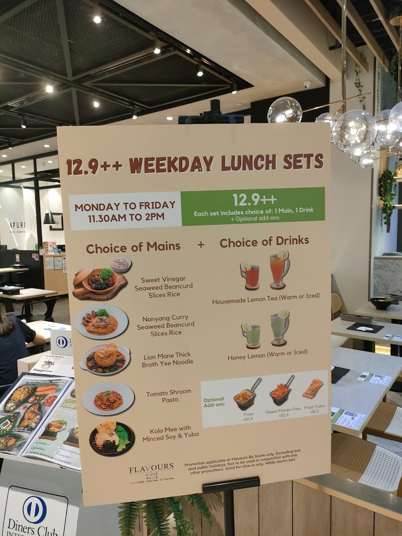 A large menu board displaying weekday lunch sets and options at Flavours by Saute.