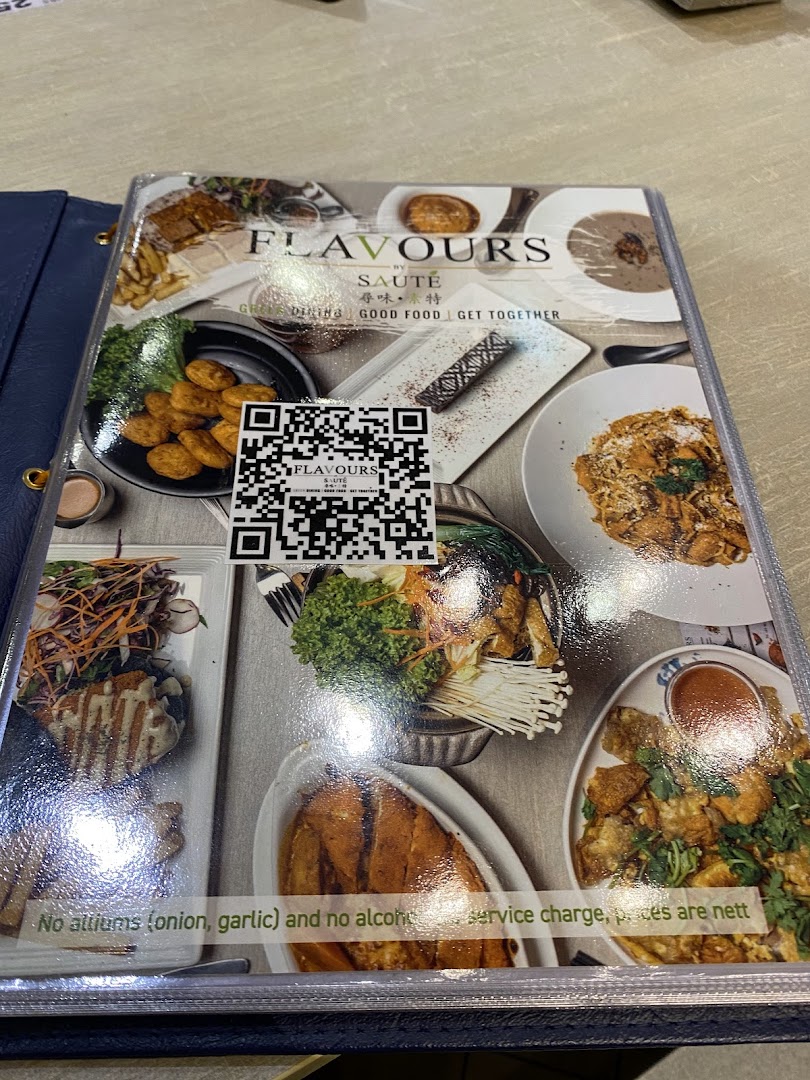A physical menu cover for Flavours by Saute, featuring food images and a QR code.
