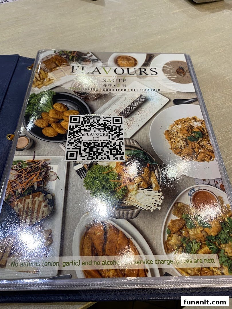 A physical menu cover for Flavours by Saute, featuring food images and a QR code.