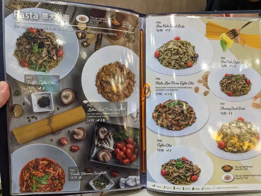 A vibrant menu page showcasing a variety of pasta dishes with descriptions, prices, and dietary information.