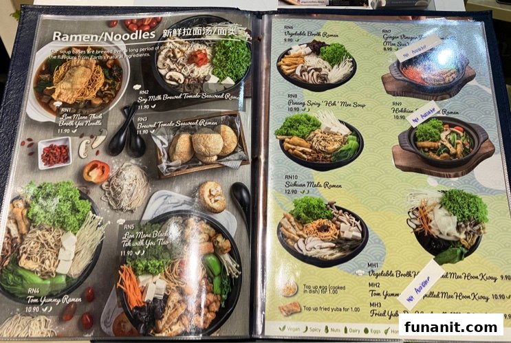 A detailed menu page showcasing various ramen and noodle dishes with prices and images.