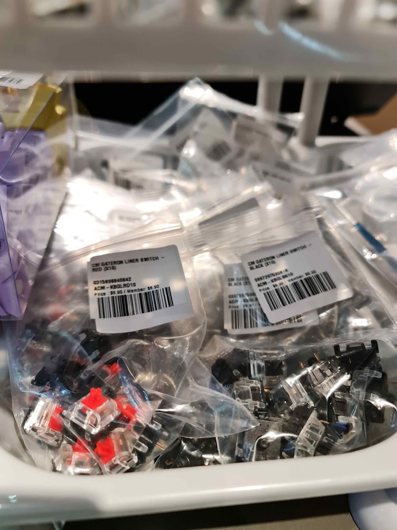 Close-up of bagged Gateron keyboard switches in red and black, with price labels, at GameMartz.