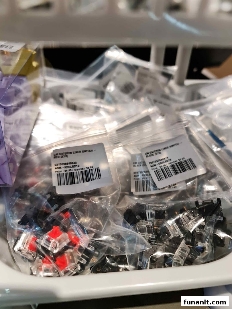 Close-up of bagged Gateron keyboard switches in red and black, with price labels, at GameMartz.
