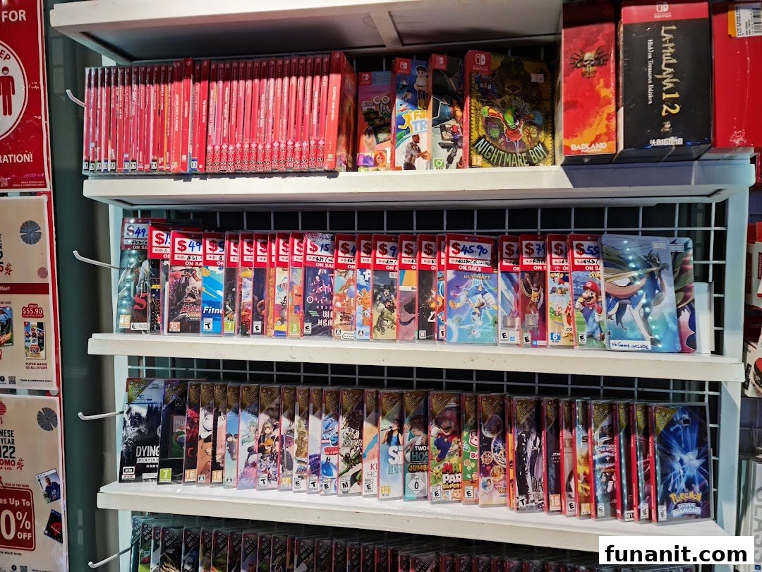 Shelves filled with numerous Nintendo Switch game titles and cases, some with sale prices.