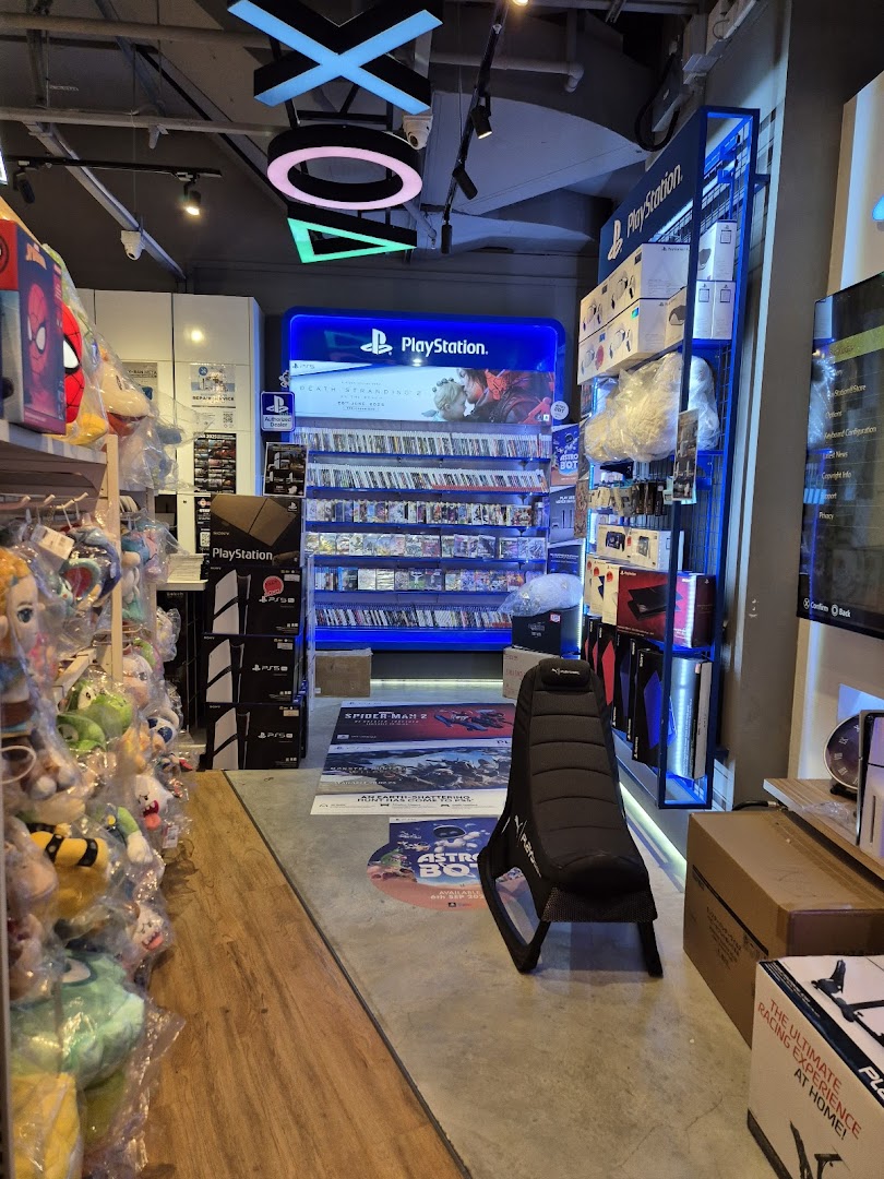 Interior view of GameMartz Funan Mall, showcasing PlayStation games, accessories, and gaming merchandise.