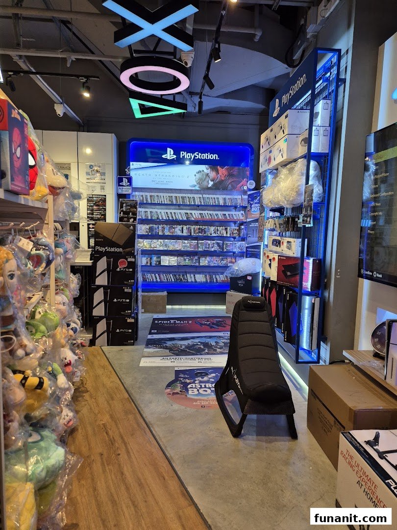 Interior view of GameMartz Funan Mall, showcasing PlayStation games, accessories, and gaming merchandise.