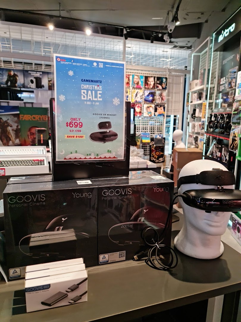A GameMartz store display featuring GOOVIS Personal Cinema VR headsets and a Christmas sale promotion.