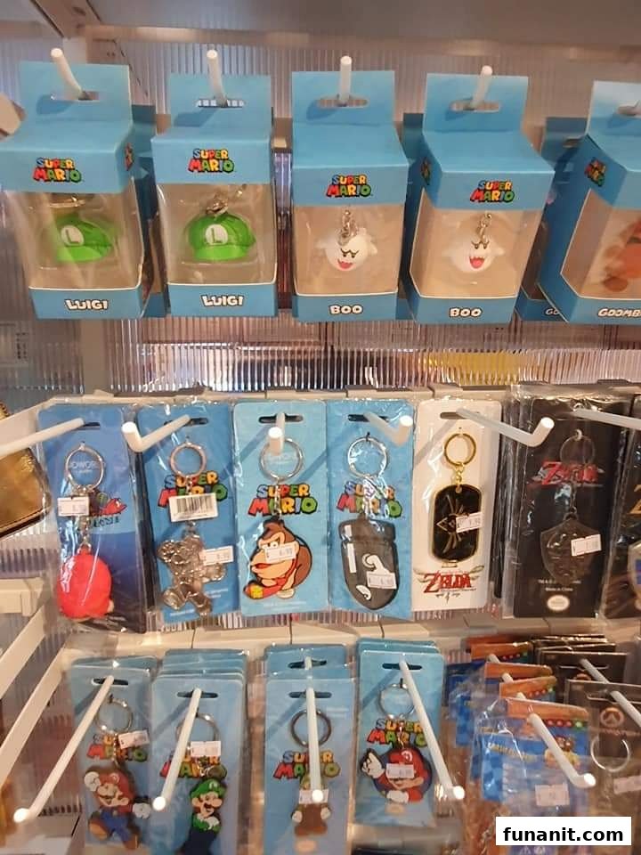 A display of Super Mario and Zelda themed keychains and small figures for sale.