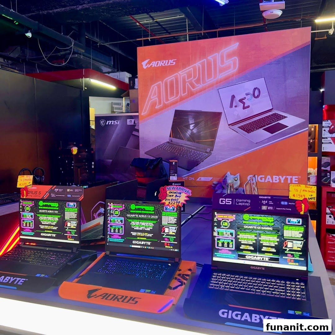 A vibrant display of high-performance gaming laptops from AORUS and Gigabyte in a tech retail store.