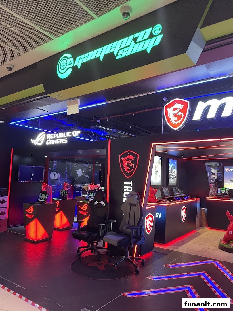 Interior of GAMEPROSG, a gaming shop, featuring gaming chairs, laptops, and prominent MSI and ROG branding.