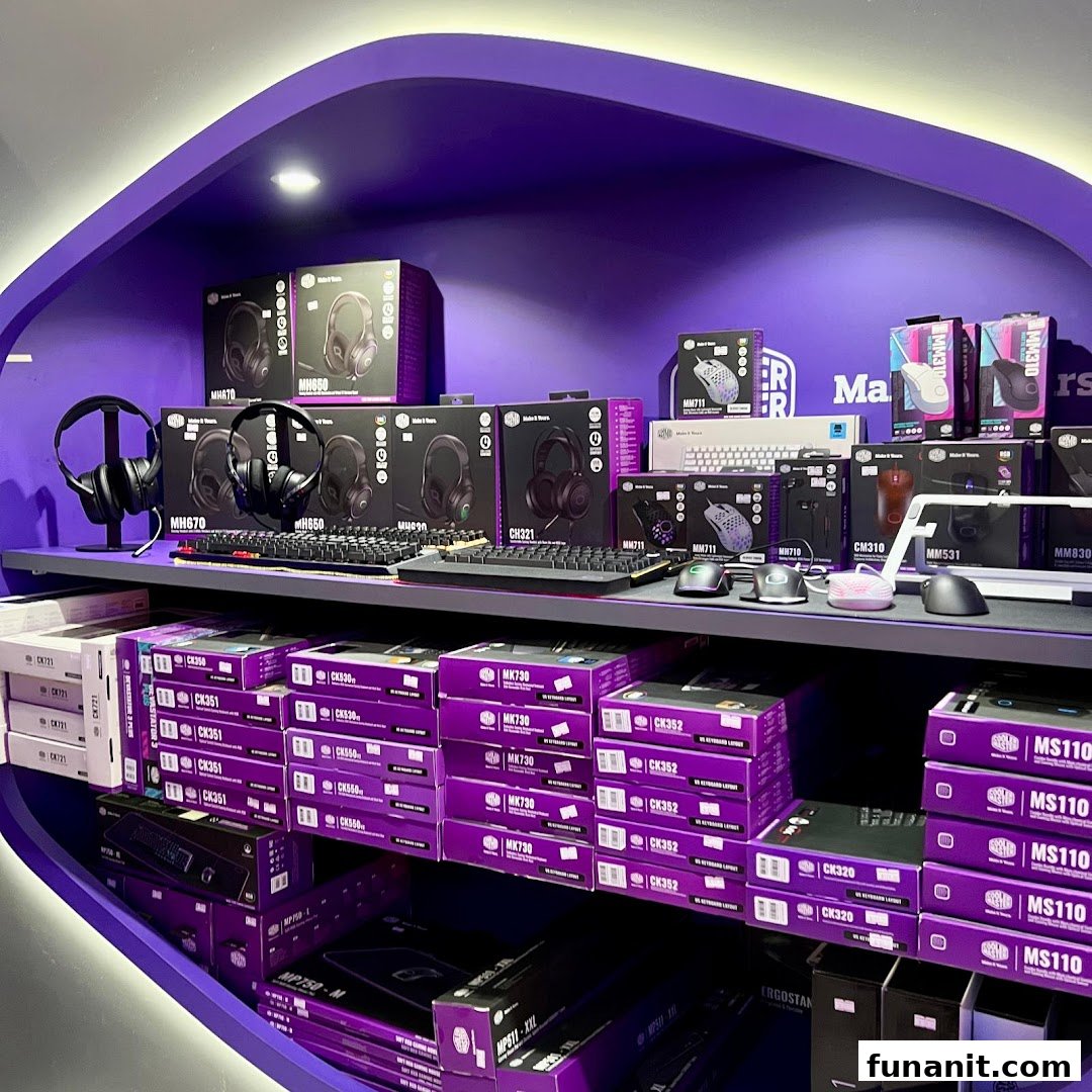 A vibrant purple display shelf showcasing a wide range of gaming peripherals like headphones, keyboards, and mice.