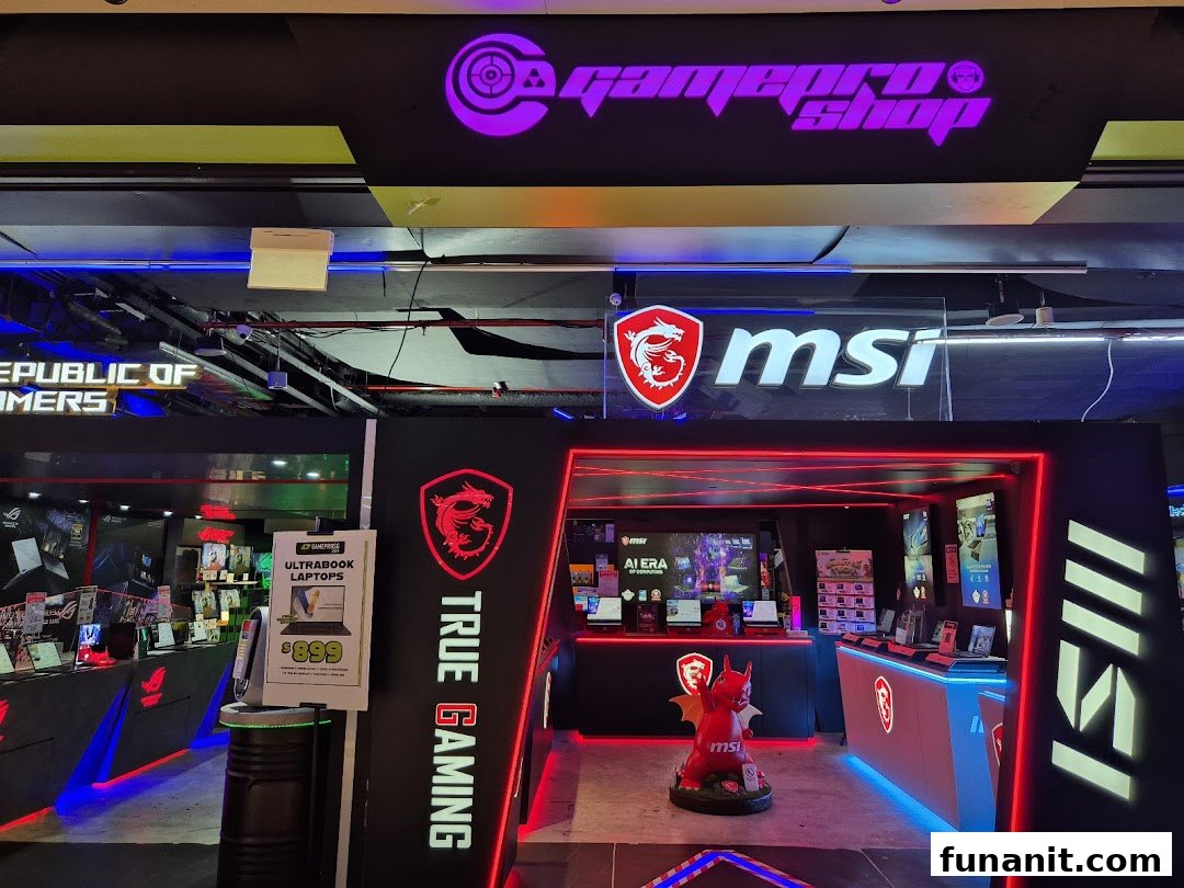 The vibrant entrance of GAMEPROSG, featuring MSI and Republic of Gamers branding and gaming laptops.