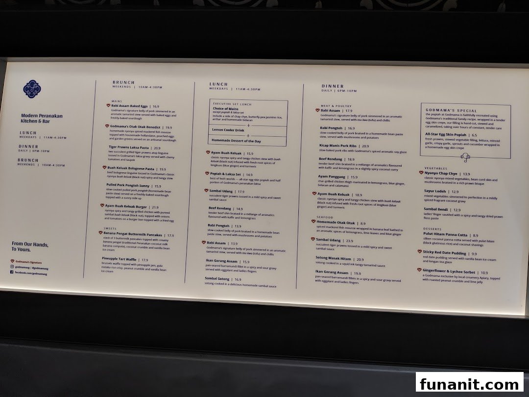 A detailed menu from Godmama, showcasing their Modern Peranakan cuisine for brunch, lunch, and dinner.