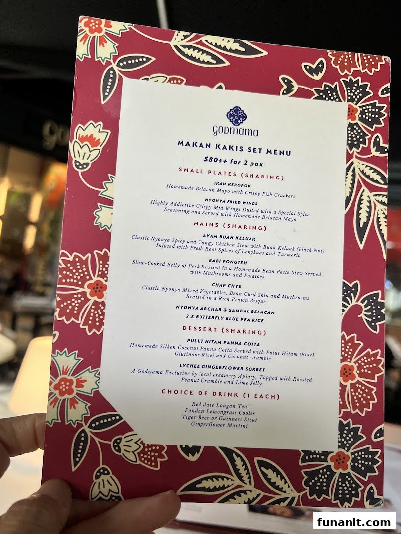 A detailed view of Godmama's Makan Kakis Set Menu, featuring Peranakan dishes and drinks.