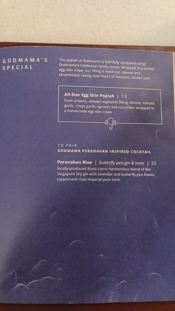 A menu page from Godmama featuring a special popiah dish and a Peranakan-inspired cocktail.