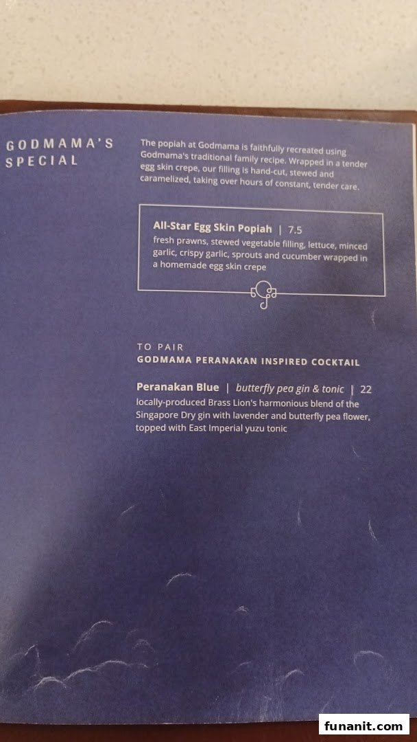 A menu page from Godmama featuring a special popiah dish and a Peranakan-inspired cocktail.