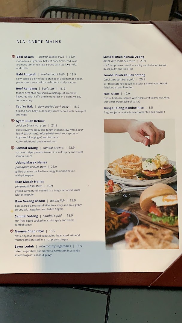 A detailed menu displaying Godmama's Ala-Carte Peranakan main courses and rice options with prices and descriptions.