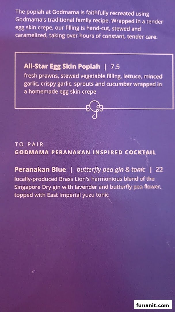 A close-up of Godmama's menu featuring their signature popiah and a Peranakan-inspired cocktail.