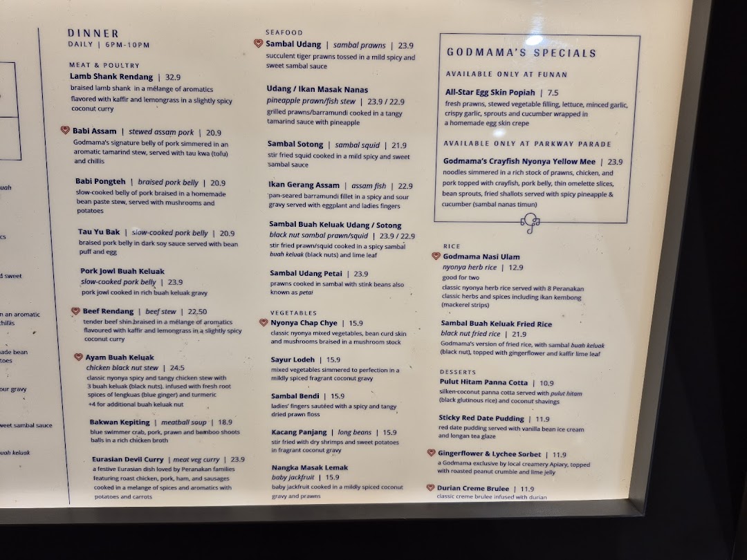 A detailed menu from Godmama, showcasing a variety of modern Peranakan dishes for dinner.