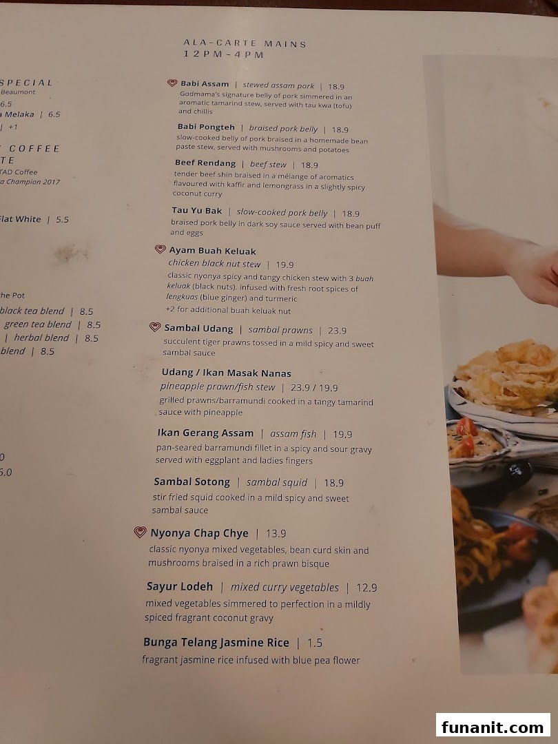 A detailed menu page showcasing Peranakan main courses and beverages with prices and descriptions.
